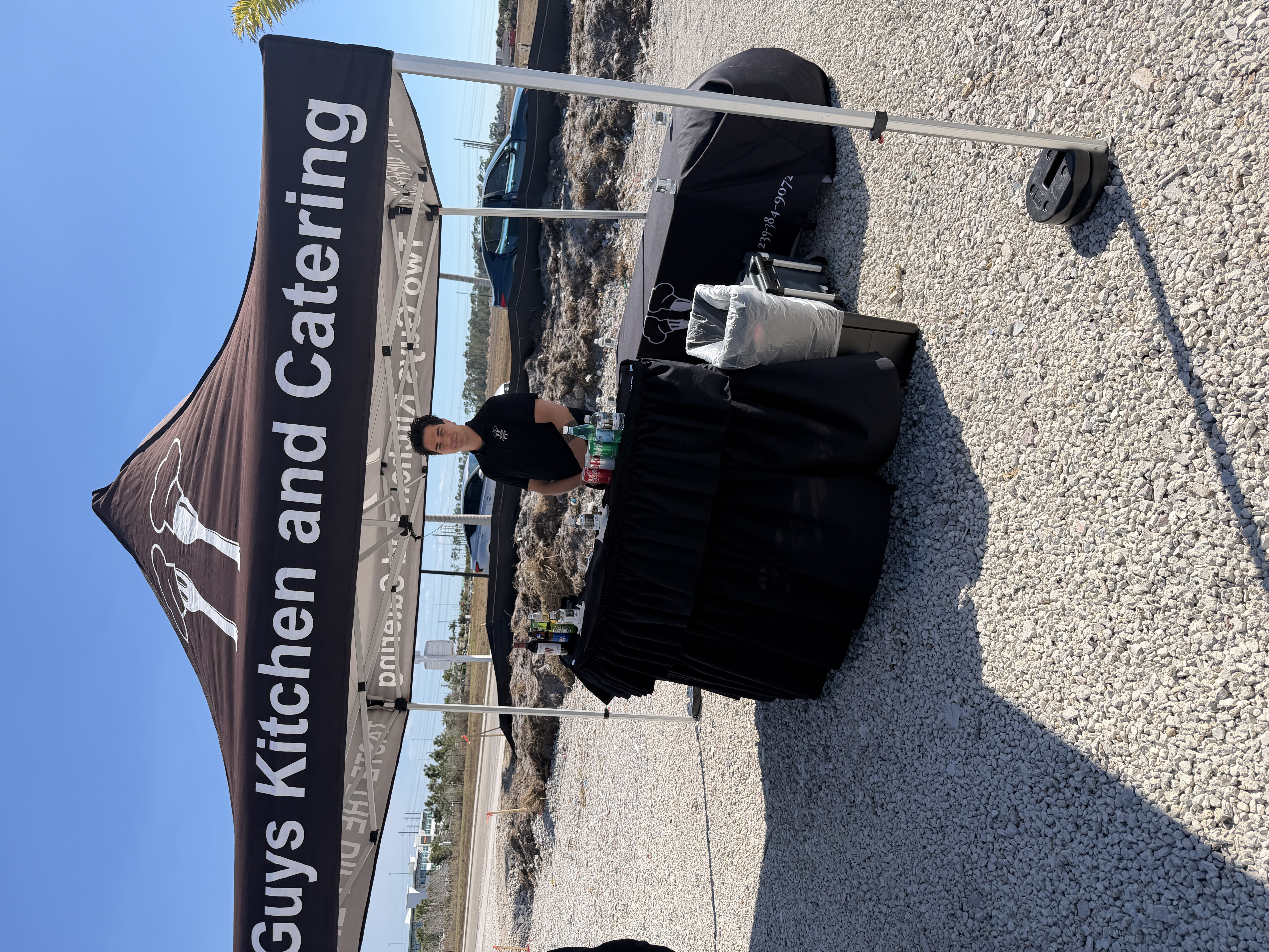 Two Guys Catering service tent at the Palms Manor groundbreaking