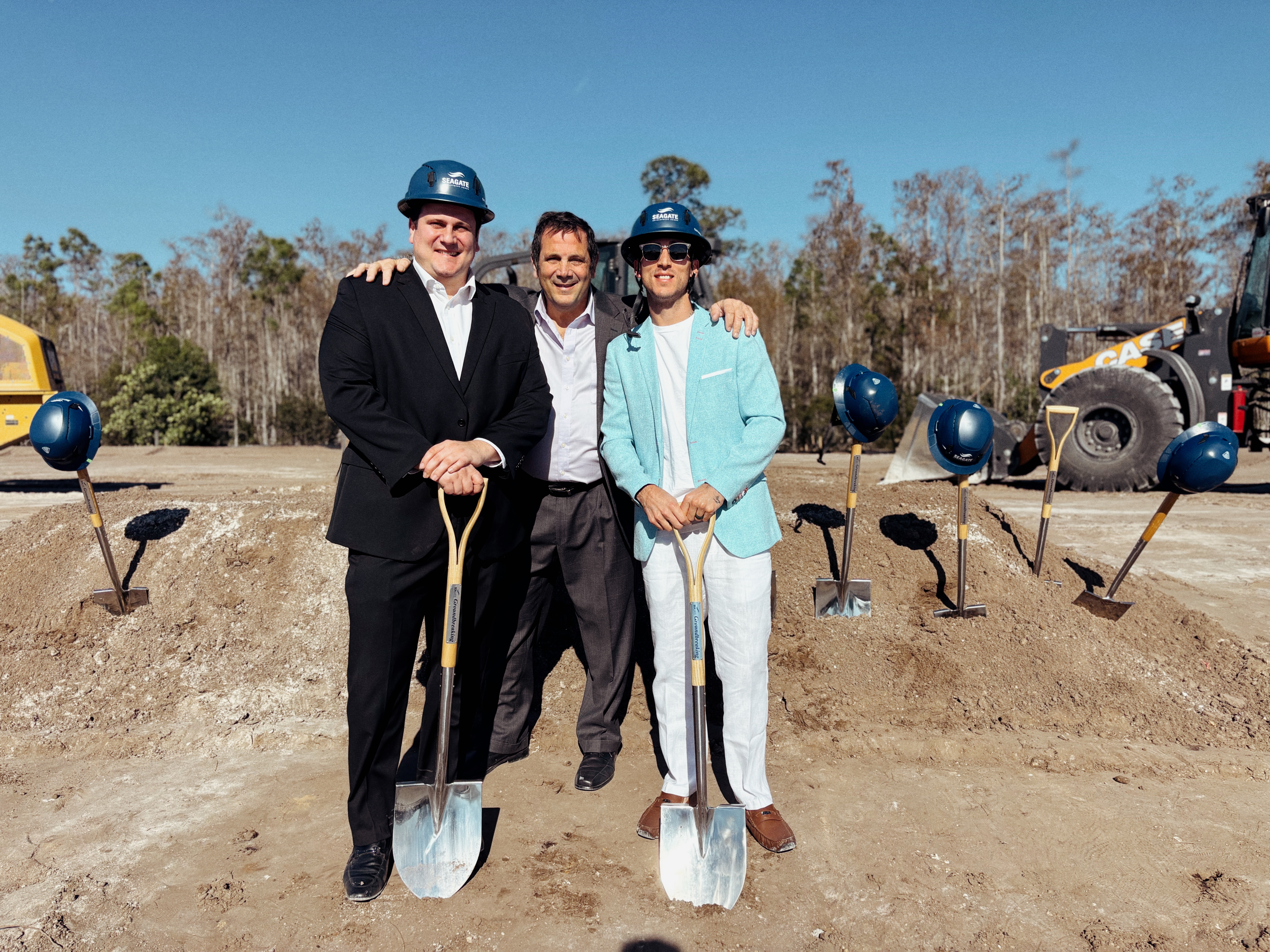 Family members with ceremonial shovels at Palms Manor
