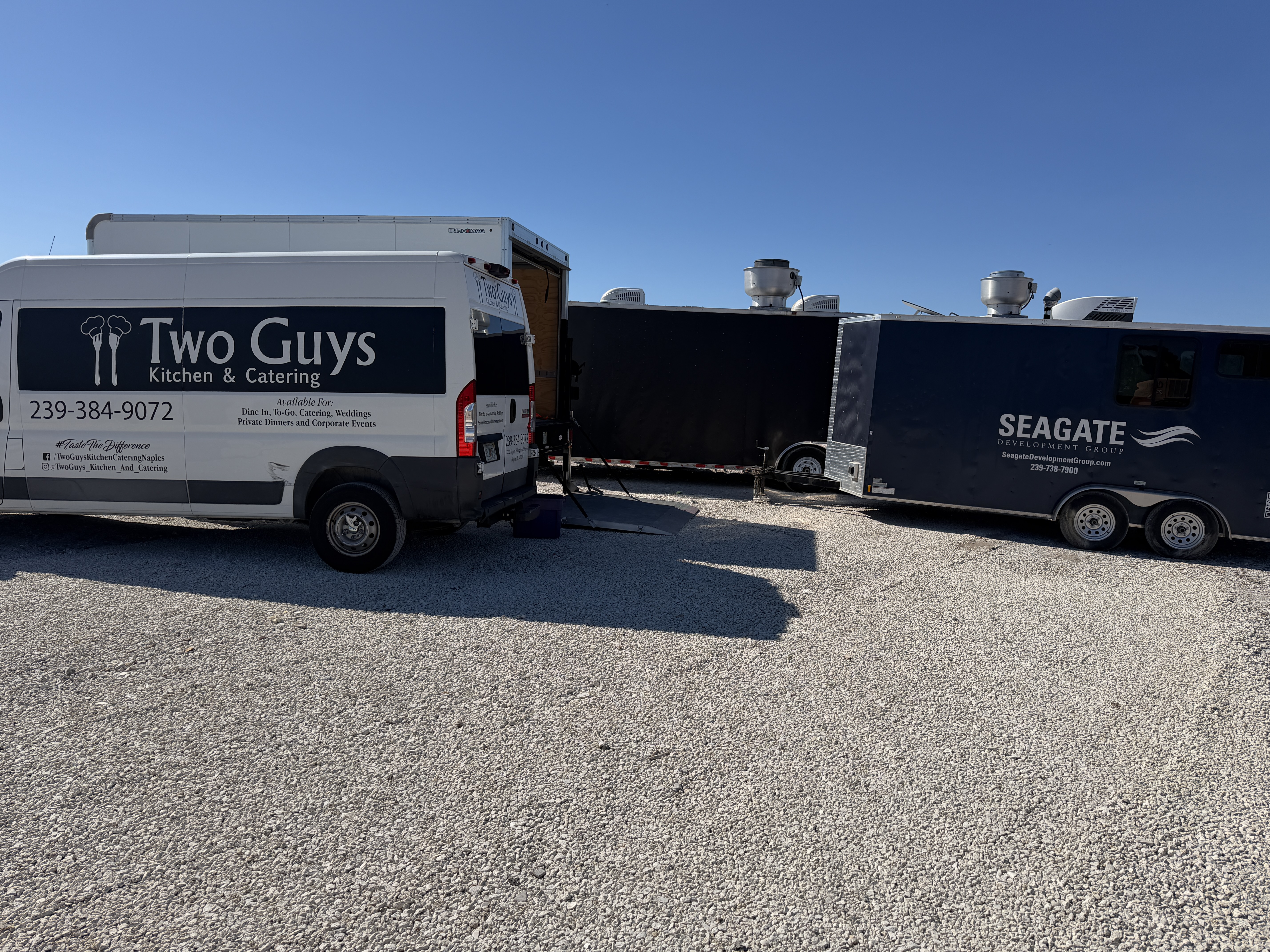 Two Guys Catering van and event trailer at the Palms Manor site