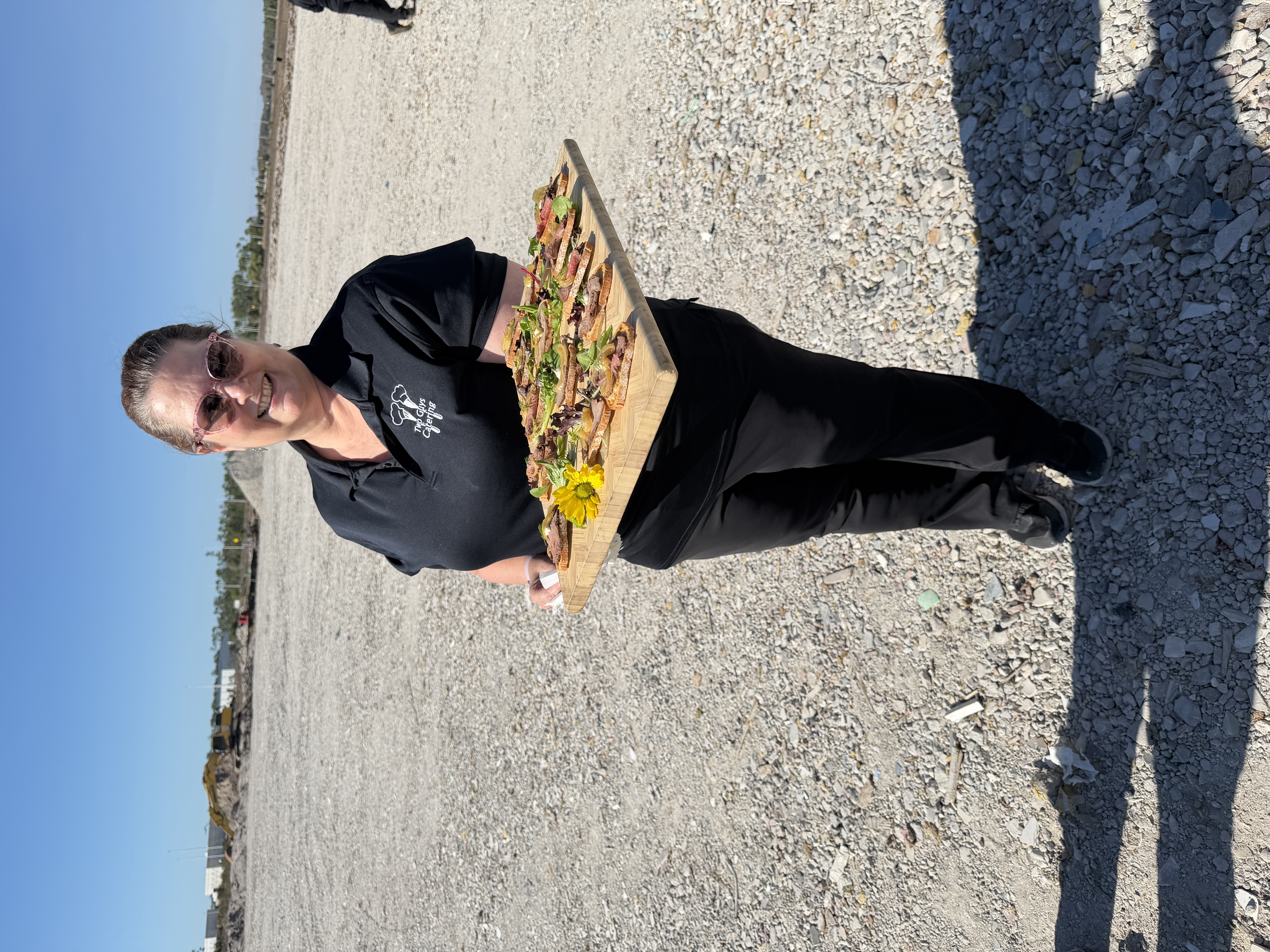 Two Guys Catering server carrying passed appetizers at the Palms Manor groundbreaking