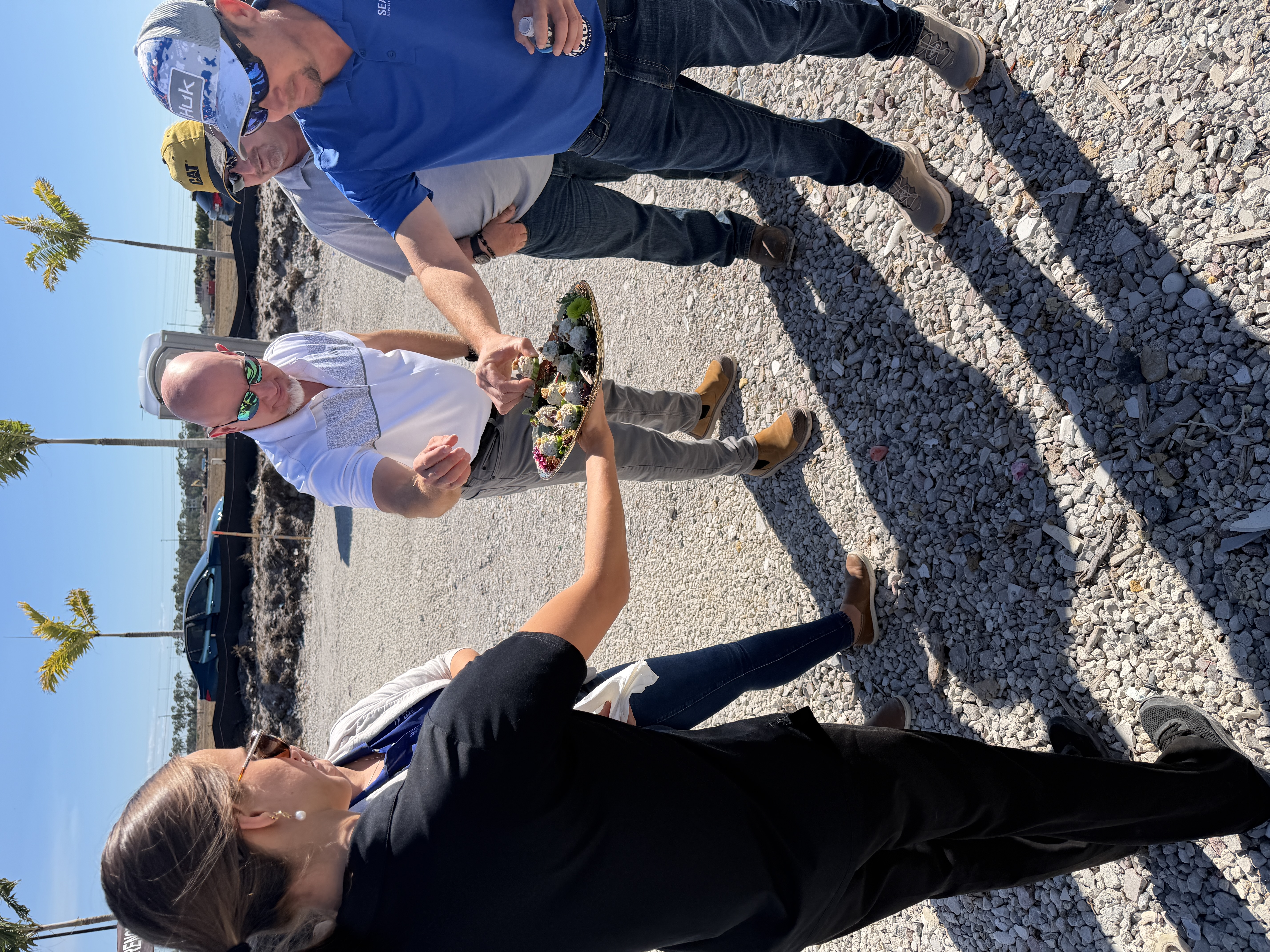 Two Guys Catering serving appetizers to groundbreaking guests